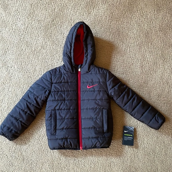 Nike size 4 XS puffy jacket. Excellent like new condition.